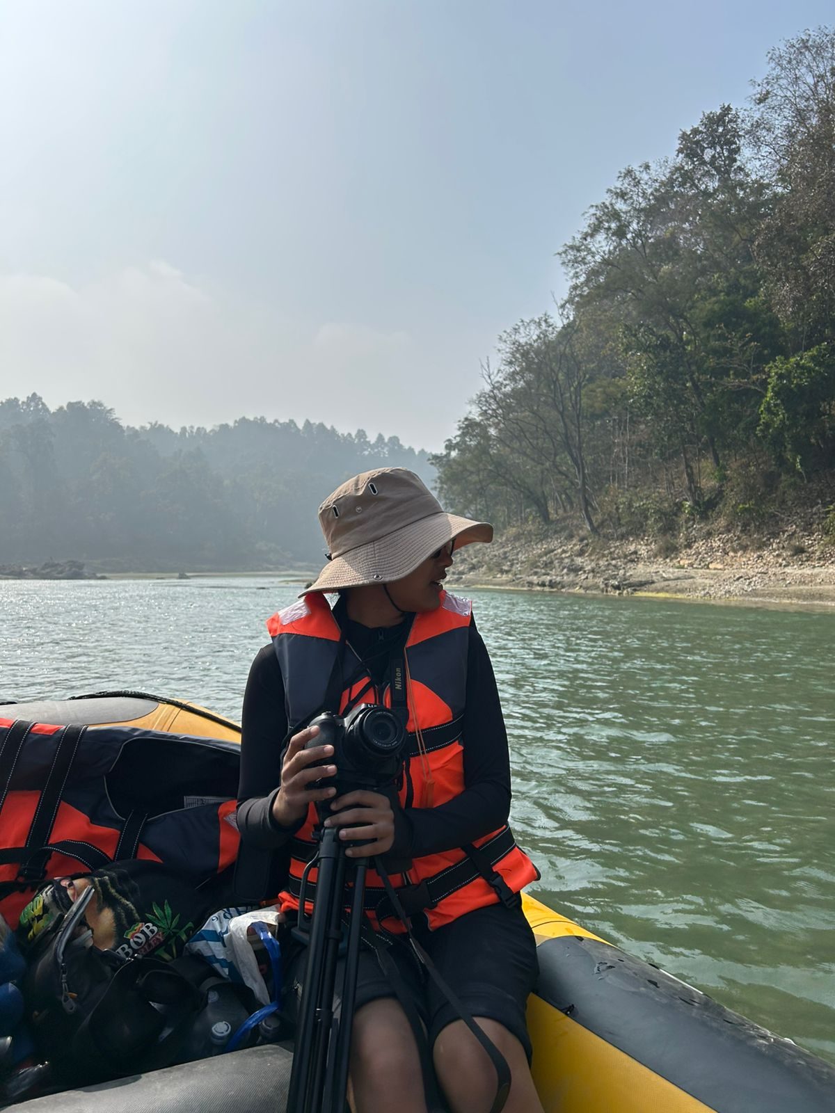 Shejal Pradhan in a raft on a river survey
